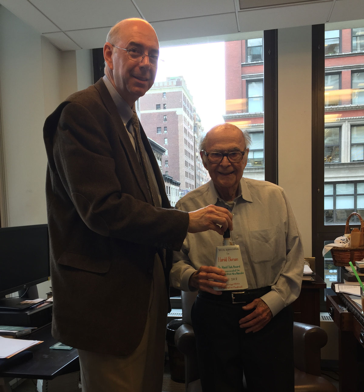 Harold Burson Receives Hand-Painted Cowbell to Honor His Receiving the first Dr. Hank Flick Award for Advancement of the Mississippi State New Narrative 